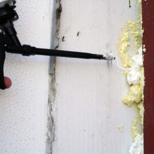 a hand holding a black object