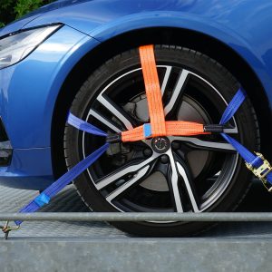 a car with straps attached to tire