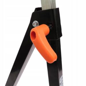 a black stand with orange handle