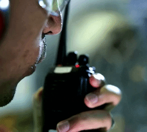 a man holding a walkie talkie