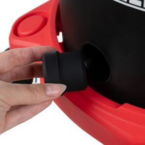 a hand holding a black object