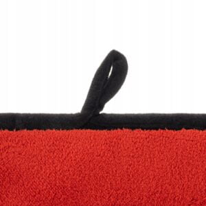 a close up of a red and black towel